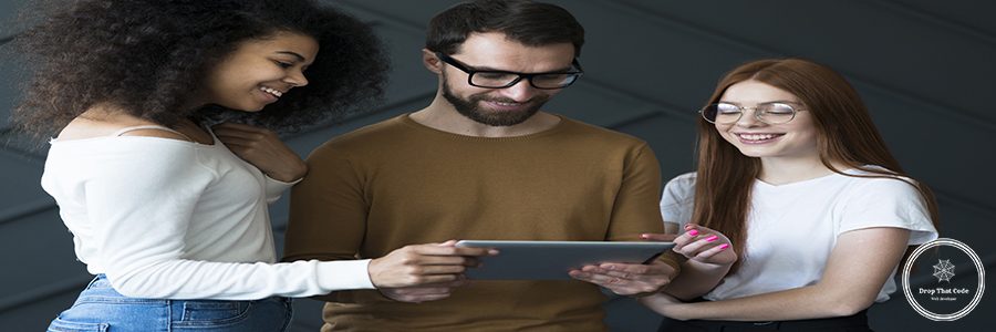 adult-man-young-women-working-together