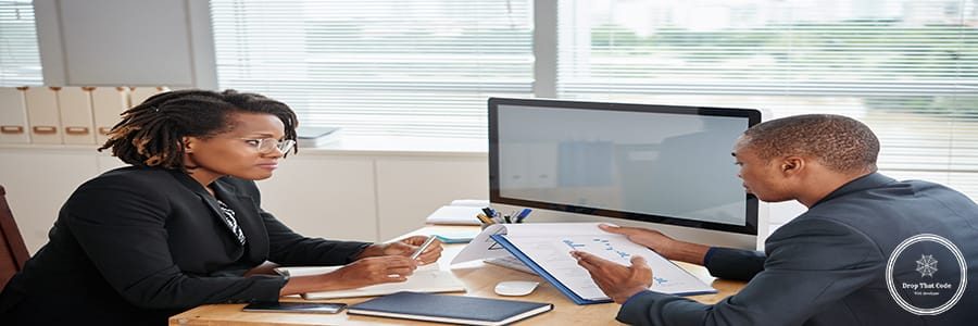 Female entrepreneur listening to report of financial manager