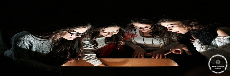 Sisters opens a box with a Christmas present and fascinated looks inside