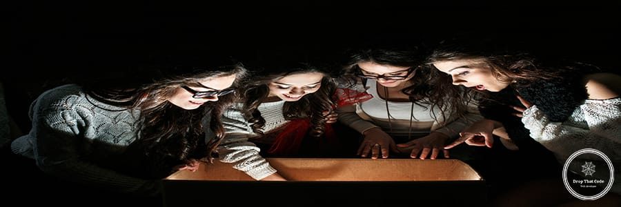 Sisters opens a box with a Christmas present and fascinated looks inside