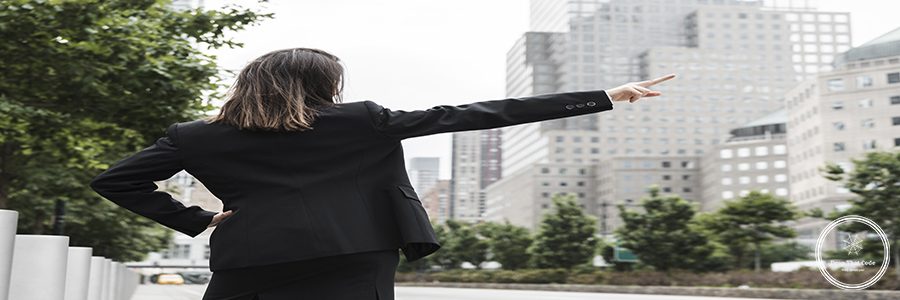 back-view-woman-suit-pointing-up