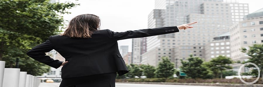 back-view-woman-suit-pointing-up