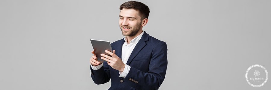 Business Concept - Portrait Handsome Business man playing digital tablet with smiling confident face. White Background. Copy Space.