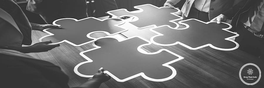 Business people connecting puzzle pieces