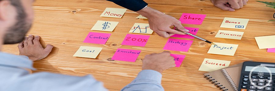 Business team gather on table, brainstorming and writing creative idea on colorful post-it notes. Planning and brainstorm strategy to achieve business targets. fervent