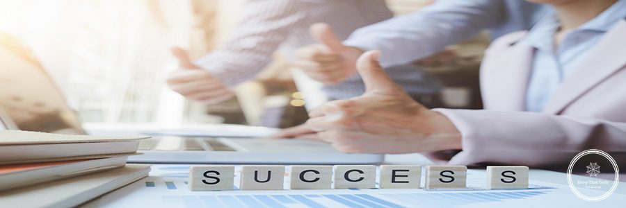 “Success” word on business working table. Wooden cross word alphabet “Success”. Business teamwork success concept.