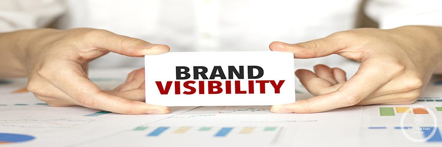 Businesswoman holding a card with text brand visibility