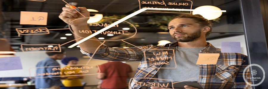 Caucasian casual businessman making notes on glass wall in office, brainstorming. Casual office, brainstorm, business and creative work, unaltered.