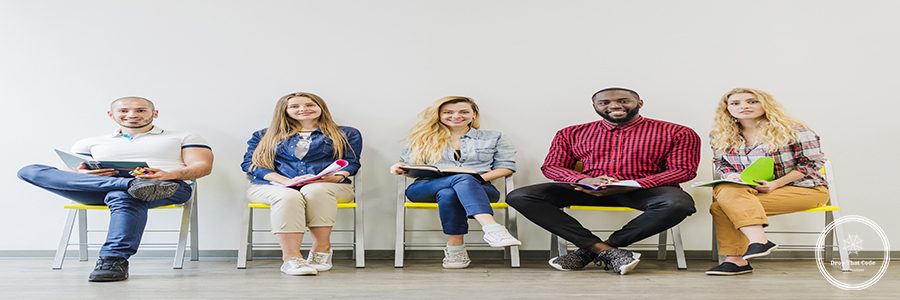 cheerful-students-posing-chairs