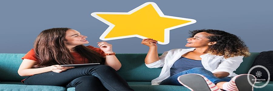 Cheerful women holding a golden star icon