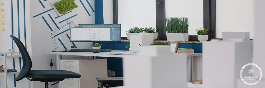 Close up of desk in architectural office with digital blueprints plans on computer. Monitor with sketch presentation for building layout and structure. Architecture urban project