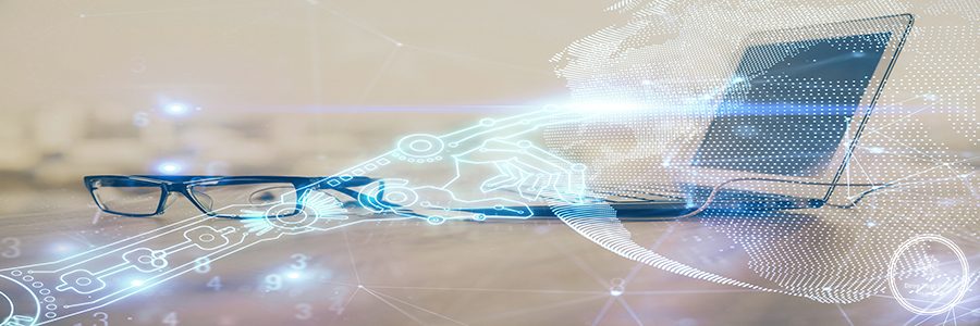 Computer on desktop in office with technology theme hologram. Multi exposure. Tech concept.