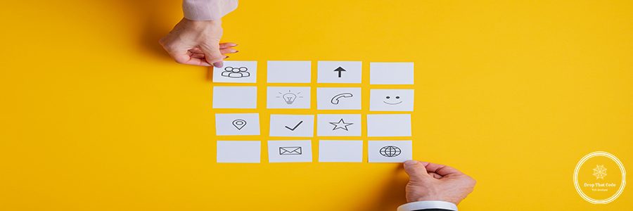 Hand of businessman and businesswoman placing post it papers with various contact and information signs on them over yellow background.