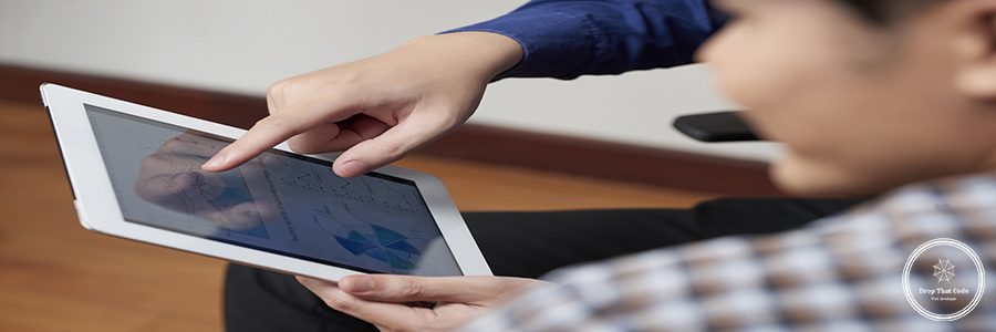 Digital tablet with diagram in hands of financial manager