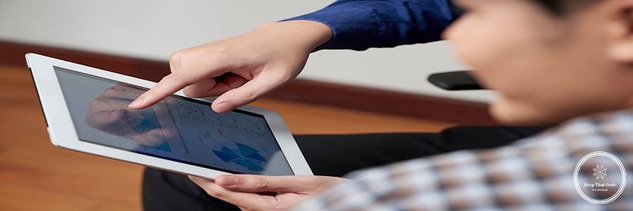 Digital tablet with diagram in hands of financial manager
