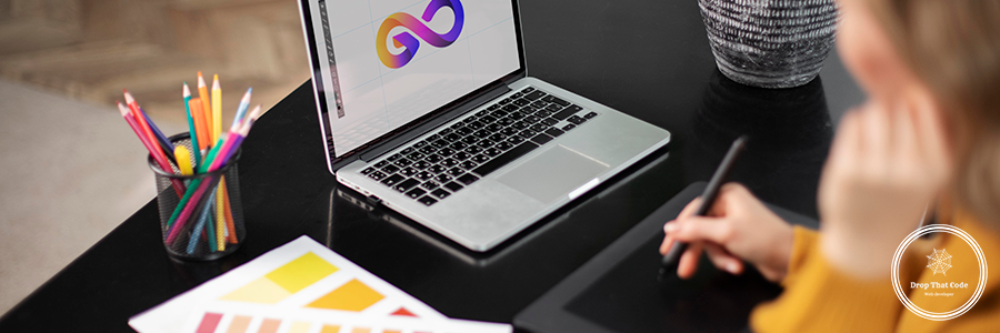 female-logo-designer-working-her-tablet-connected-laptop