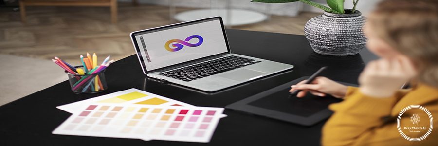 female-logo-designer-working-her-tablet-connected-laptop