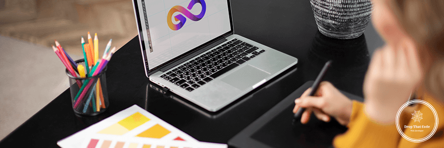 female-logo-designer-working-her-tablet-connected-laptop