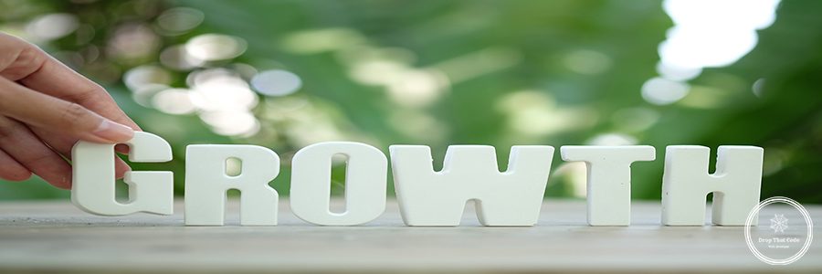 Hand arrange white letters as GROWTH