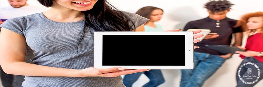 happy-woman-showing-blank-screen-digital-tablet-standing-front-her-friends