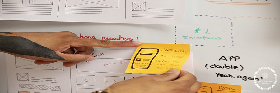 high-angle-hands-holding-post-its