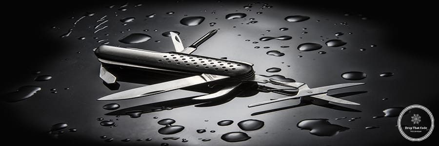 A high angle shot of metal multi-purpose knife with water droplets isolated on black background