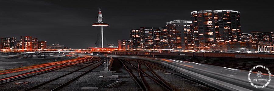 high-angle-view-illuminated-railroad-tracks-amidst-buildings-city-night