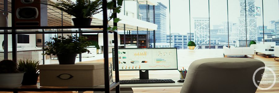 High end company office with a computer showing detailed data insights, executive business meetings or financial planning in a boardroom. Project development in a modern workspace.