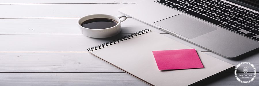 laptop-notepad-composition-desk