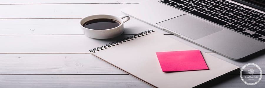 laptop-notepad-composition-desk