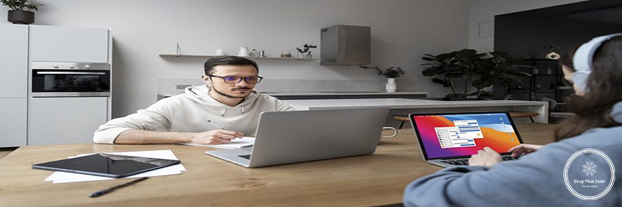 man-woman-working-from-home-together-desk