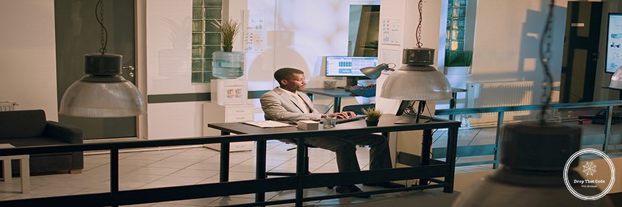 Management executive verifying worker accounting project task progress in office at night. Business manager overseeing employee crosschecking financial information during nightshift