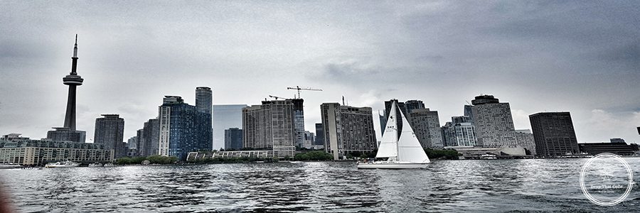 modern-buildings-by-river-against-sky-city