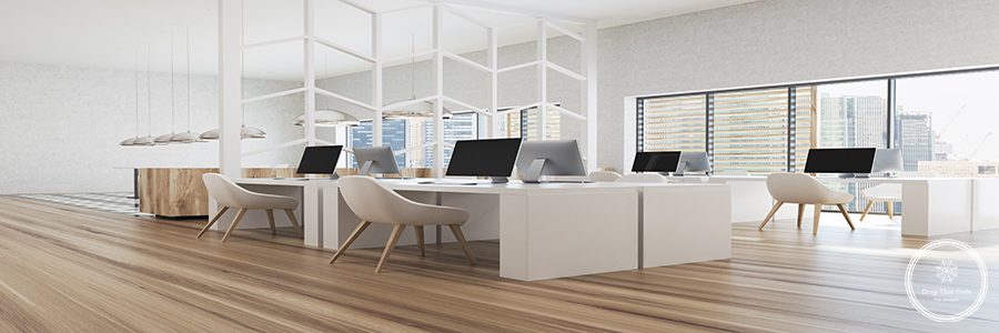 Modern white office corner with white walls, panoramic windows and white computer tables. A wooden floor, a side view. 3d rendering mock up