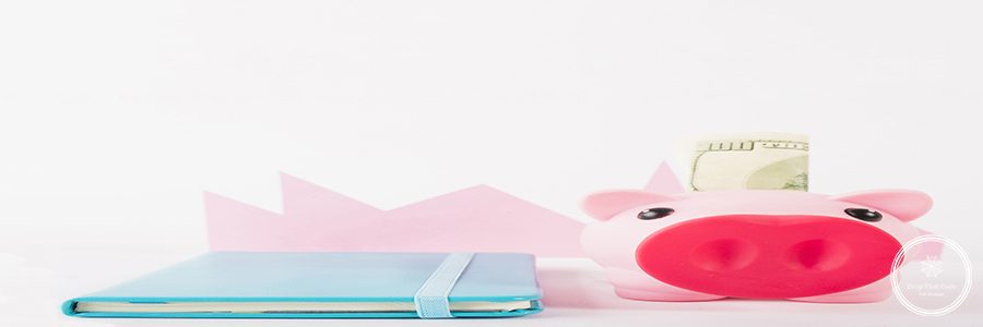 notebook-piggy-bank-with-money-white-background