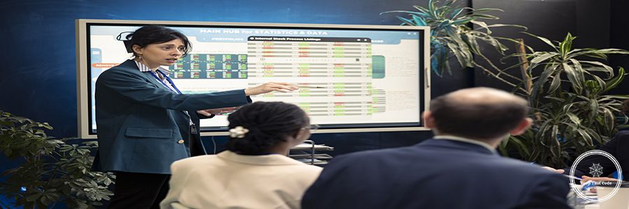 Office manager presenting data analysis and funding on interactive board, deliberating on income and revenue growth with her affiliates. Accomplishing financial objectives in the organization.