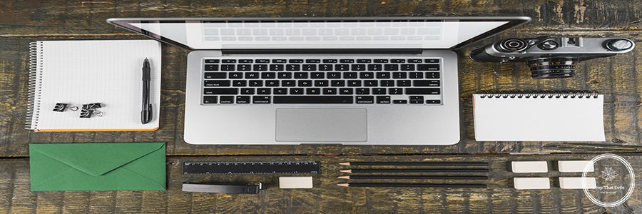 overhead-view-arranged-office-stationeries-laptop-retro-camera-wooden-desk