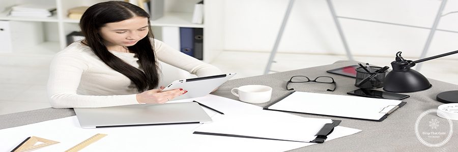 overhead-view-businesswoman-looking-digital-tablet-workplace