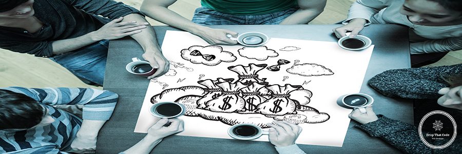 People sitting around table drinking coffee with page showing profit doodle