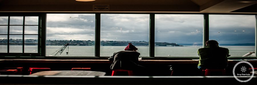 rear-view-men-sitting-by-window-restaurant