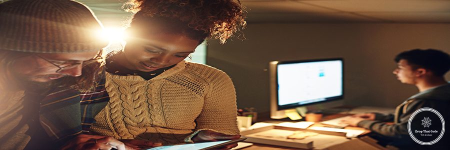 Research, tablet and teamwork with people in office at night for strategy, website and review. Internet, collaboration and planning with man and woman in digital agency for proposal, project and idea.