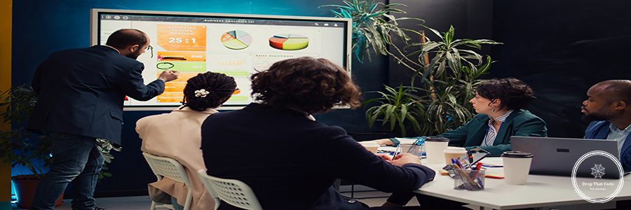 Sales manager creates a presentation to pitch in a new strategy for development, using interactive board to make his staff members understand the objectives. Business planning meeting. Camera B.