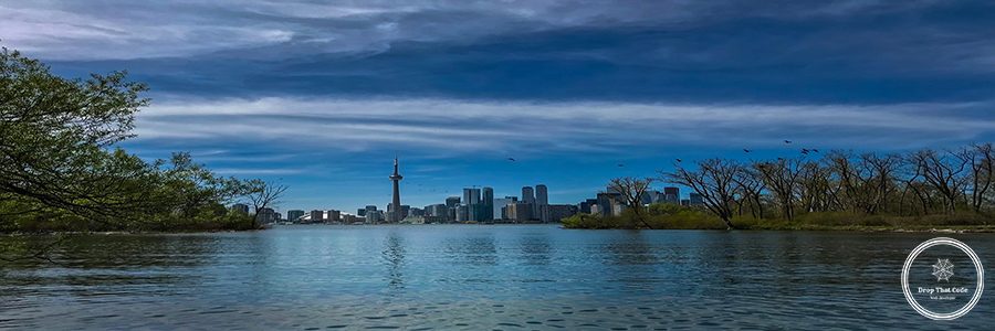 scenic-view-river-by-buildings-against-sky