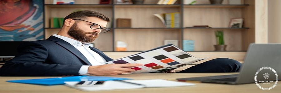 side-view-man-reading-desk