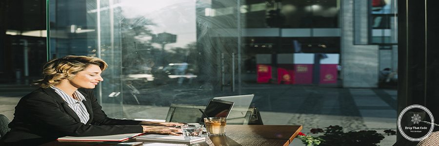 side-view-smiling-young-businesswoman-working-laptop-restaurant