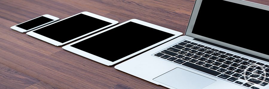 laptop with tablet and smart phone on table