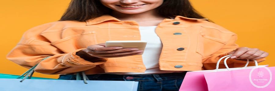 smiley-woman-looking-smartphone-holding-lots-shopping-bags