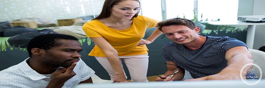 Male and female graphic designers interacting with each other in office