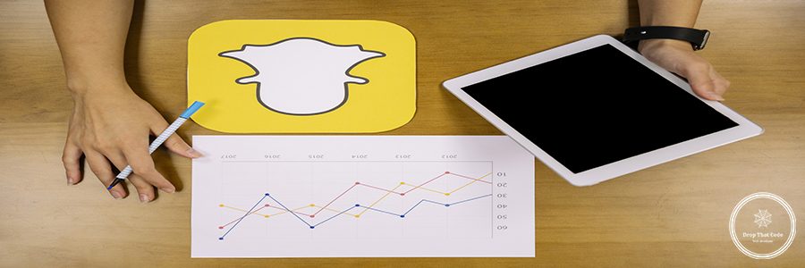 social-media-planner-analyzing-snapchat-graph-with-digital-tablet