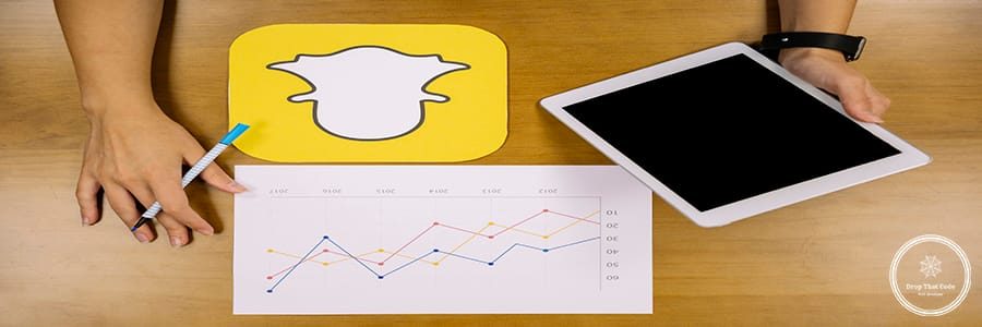 social-media-planner-analyzing-snapchat-graph-with-digital-tablet